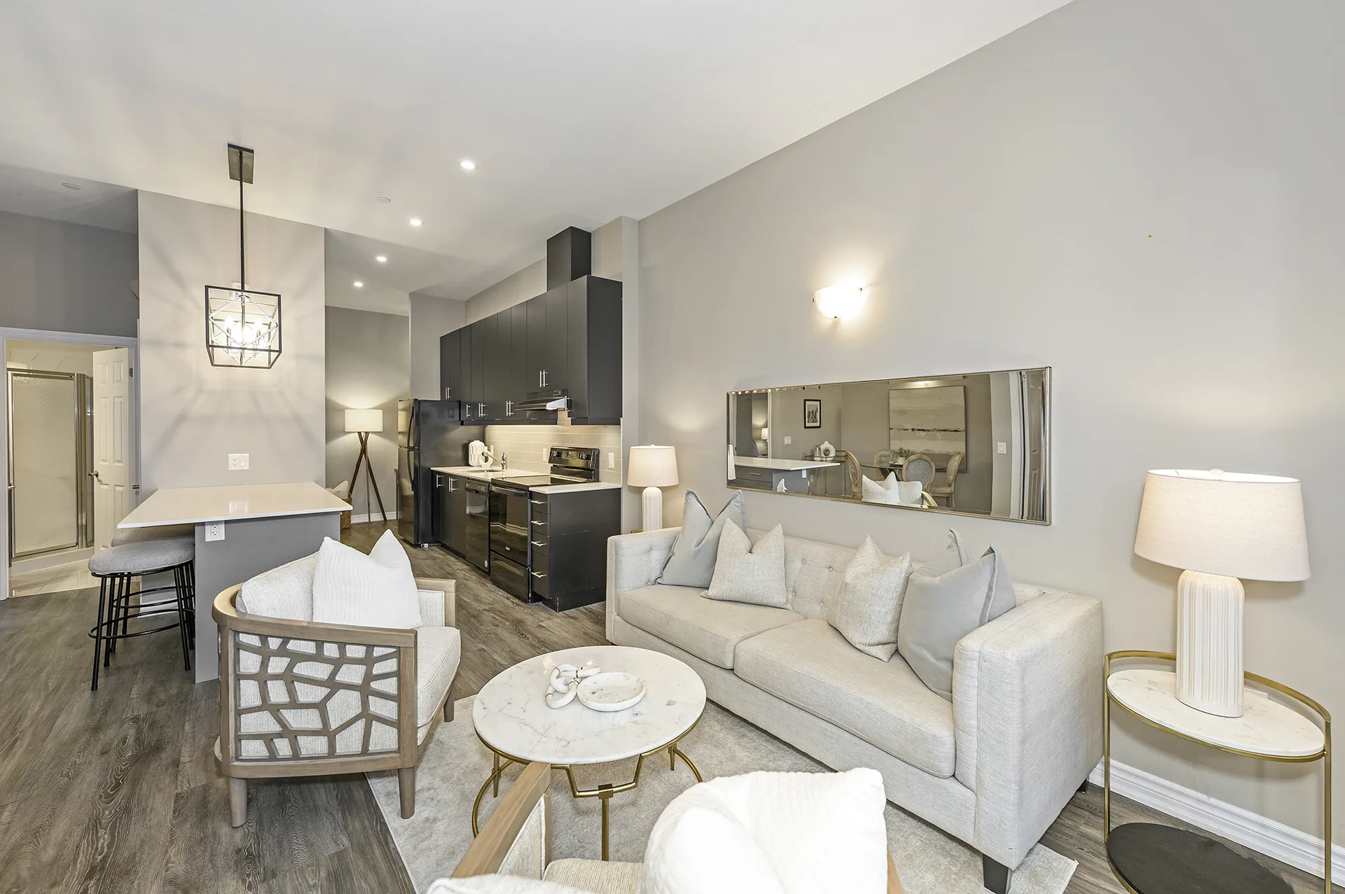 Staged condo living room and kitchen